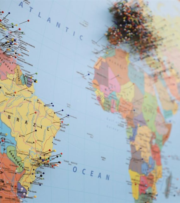 A world map with pins marking shipping destinations