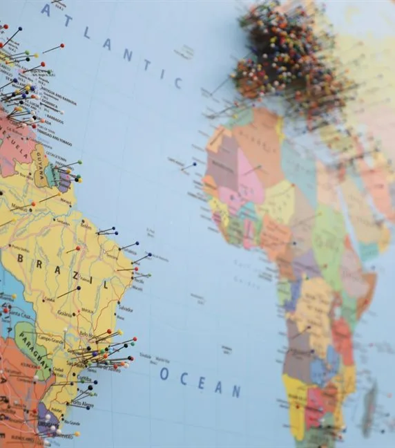 A world map with pins marking shipping destinations